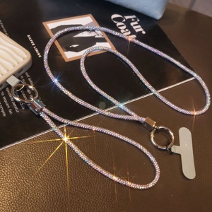 Close-up of luxury full rhinestone phone lanyard with grey patch and silver metal clasp