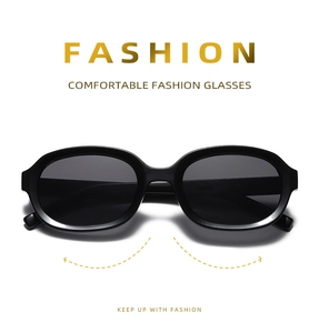 Detail shot of oval glossy black fashion sunglasses with a comfortable frame design