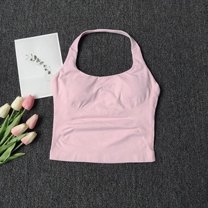 Detail of pink halter neck sports vest showing side striped texture and seamless knit fabric