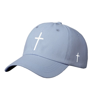 Classic light blue baseball cap with white cross embroidery and curved brim