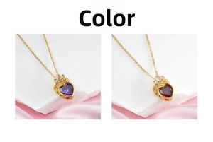 Detail view of heart pendants with crown design in purple and red stones