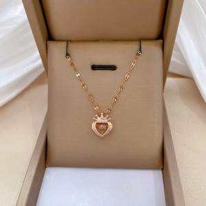 Elegant rose gold titanium necklace with sparkling crown heart pendant in a gift box