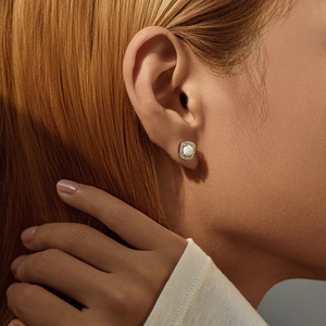 Elegant S925 silver square synthetic opal stud earrings with diamond halo on model