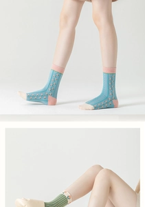 Close-up of floral jacquard cotton crew socks in blue and green vintage patterns