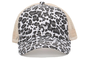 Close-up of leopard print canvas and breathable mesh back on the trucker baseball cap