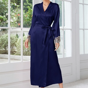 Detailed view of the dark blue silk robe featuring intricate lace embroidery on cuffs