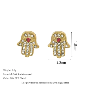 Detail of Hamsa Hand stud earrings in 18K PVD plated steel with zircon inlay
