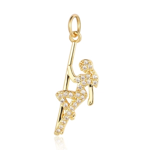 Detailed view of a gold-plated pole dancer pendant inlaid with sparkling zircon crystals