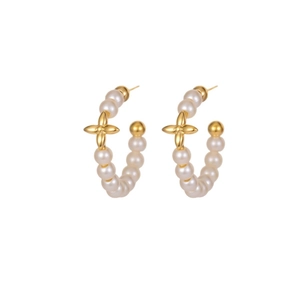 Elegant C-shaped pearl hoop earrings featuring gold flower charms and silver needle posts