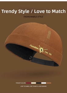 Detail of retro brown Miki hat with Freedom new life embroidery and adjustable strap