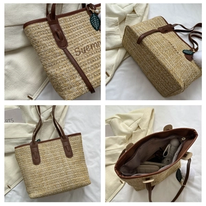 Macro detail of straw woven tote with leather trim, summer embroidery and inner pocket