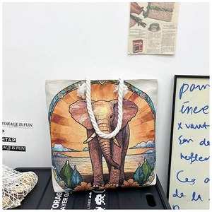 Close-up of elephant embroidery canvas tote bag with thick white cotton rope handles