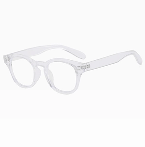Detail shot of round transparent frame glasses with a clear modern design and metal hinges