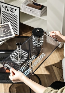 Modern acrylic serving tray with silver metal handles and light luxury home typography
