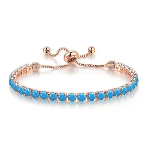 Detail of rose gold adjustable tennis bracelet with oval blue gemstones and slider clasp