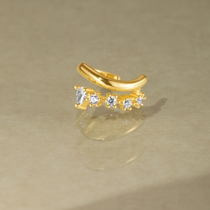Detail of gold ear cuff with marquise and round cubic zirconia stones in a double row