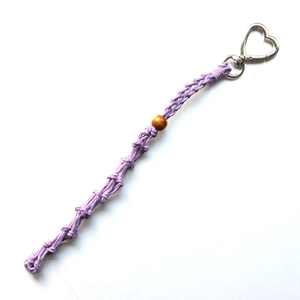 Detail of lavender woven mesh bag pendant with wood bead and heart-shaped silver metal clip
