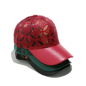 Close-up of geometric pattern caps with gold foil accents and matte leather brims