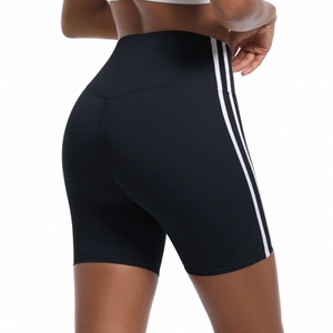 Detail showing the back view of high-waist black yoga shorts with white side stripes