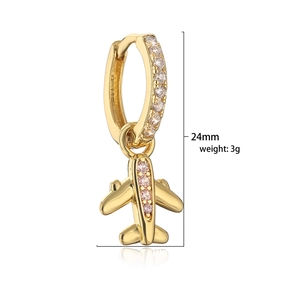 Detail view of 24mm gold airplane earring with pink zircon and white pave crystals