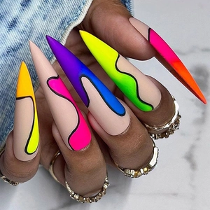 Macro shot of extra long stiletto press-on nails with colorful abstract wave patterns