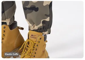 Detail of camouflage jogger pants paired with yellow lace-up warrior work boots