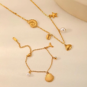 Golden stainless steel beach style jewelry set with sea shell and starfish charms