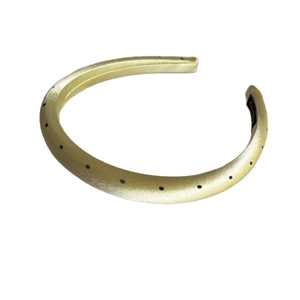 Elegant champagne yellow satin headband with black polka dots shown on a white background