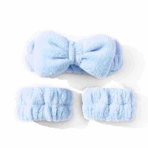 Detailed view of blue coral fleece bow headband and matching wrist wash bands set