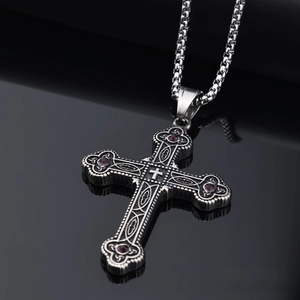 Close-up of Viking cross pendant with purple stones and vintage blackened finish detail