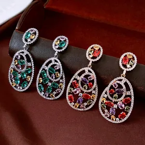 Vintage hollow teardrop earrings with colorful zircon stones on silver and gold bases