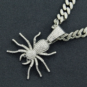 Silver iced out spider pendant necklace with black gem eyes and cuban chain for men
