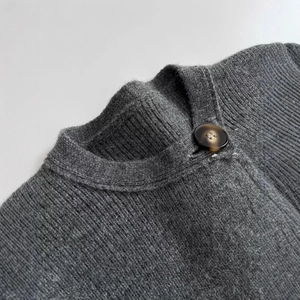 Grey knit cardigan coat featuring a round neck and exquisite tortoiseshell resin button
