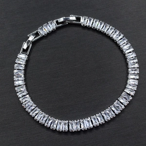 Detailed close-up of zircon bridal bracelet with rectangular crystals and silver plating