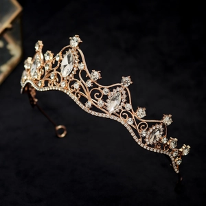 Macro detail of rose gold tiara featuring intricate floral crystal and rhinestone patterns