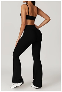 Detailed back view of high-waisted black flared yoga leggings with flattering fit