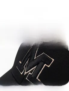 Close-up of high-quality fabric texture and 3D embroidered M logo on black baseball cap