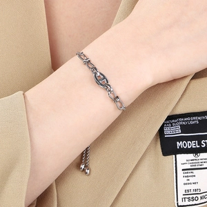 Detail of silver stainless steel pig nose anchor chain bracelet with adjustable slider