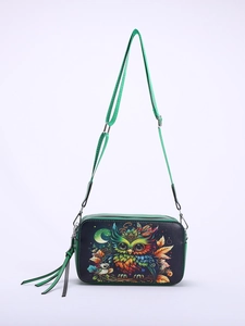 Artistic cat owl printed crossbody bag with green strap and tassel detail on white background