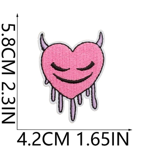 Detailed view of pink heart embroidery patch with purple horns and 5.8x4.2cm size marks