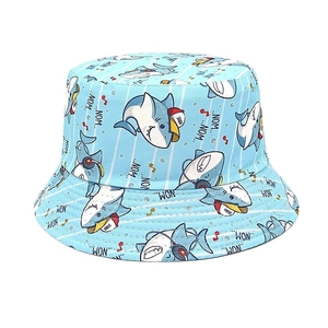 Close-up of light blue kids bucket hat with shark prints and cartoon musical motifs
