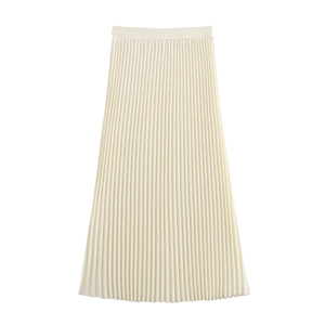 Detailed close-up of cream pleated midi skirt with elegant vertical textures and soft drape