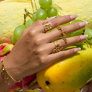 18K gold plated stainless steel music note rings and bracelet set on model hand