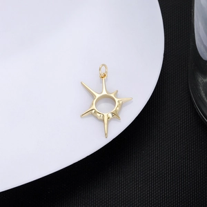Macro detail of 18K gold plated minimalist star pendant with circular hollow center design