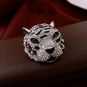 Vintage silver tiger head brooch with white zircons and black enamel for suits