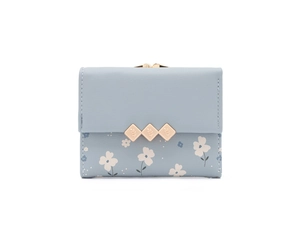 Detailed view of light blue floral print tri-fold wallet with gold diamond metal clasp