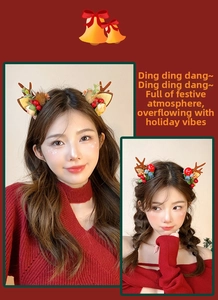 Detailed view of Christmas reindeer antler hair clips with plush ears and festive berries