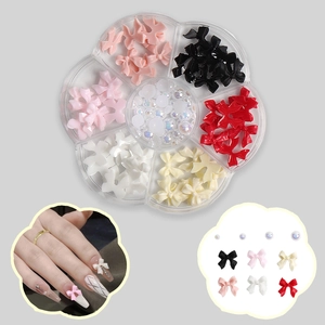 3D colorful resin bow nail charms set with iridescent pearls in flower storage box