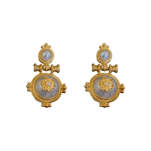 Vintage gold pearl flower earrings with intricate baroque style metal design in studio light