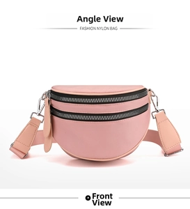Front view of pink nylon crescent bag featuring double zippers and wide shoulder strap